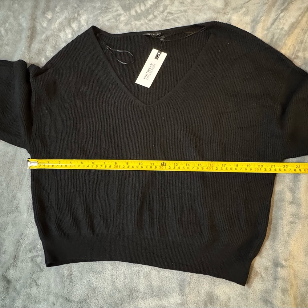 Dynamite Black V-Neck Sweater for Women
#1377 - Picture 2 of 6